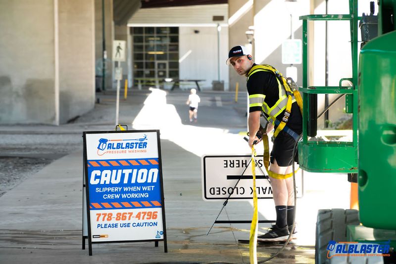 Pressure washing on Cambie Bridge in Vancouver. A contractor is doing site preparation