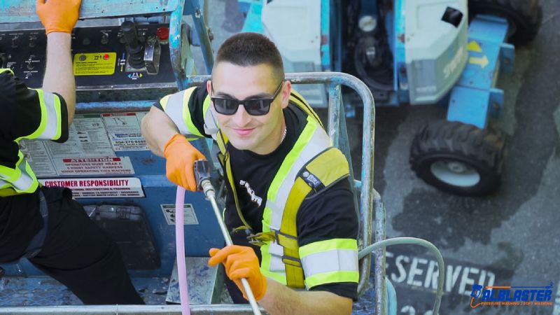 Pressure washing contractor smiling