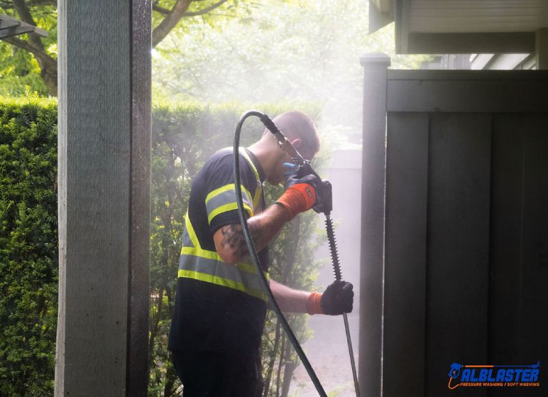 Strata pressure washing crew in action.