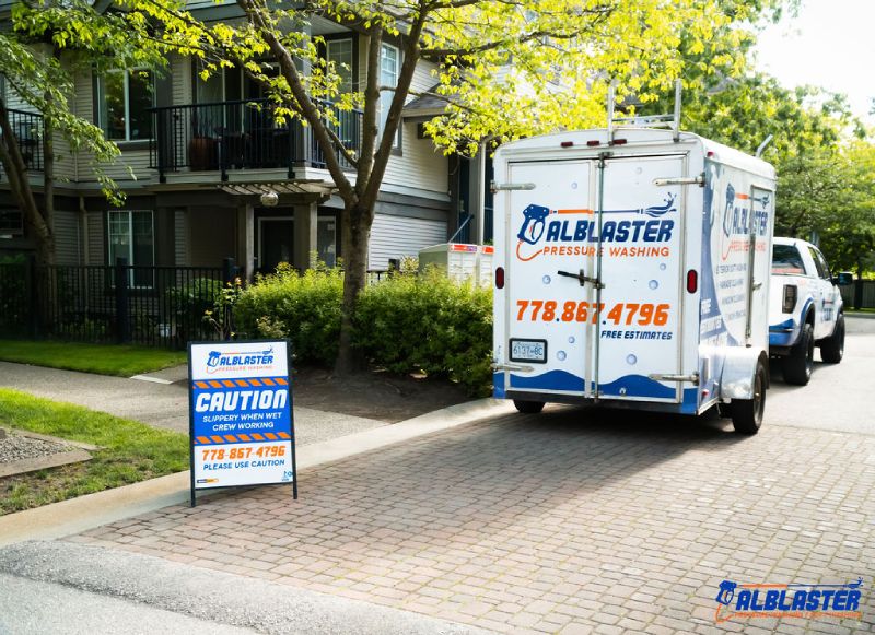 Pressure washing truck on work site in Richmond.