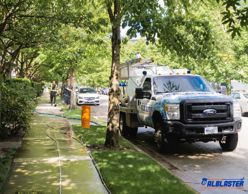 Alblaster pressure washing crew and truck at work